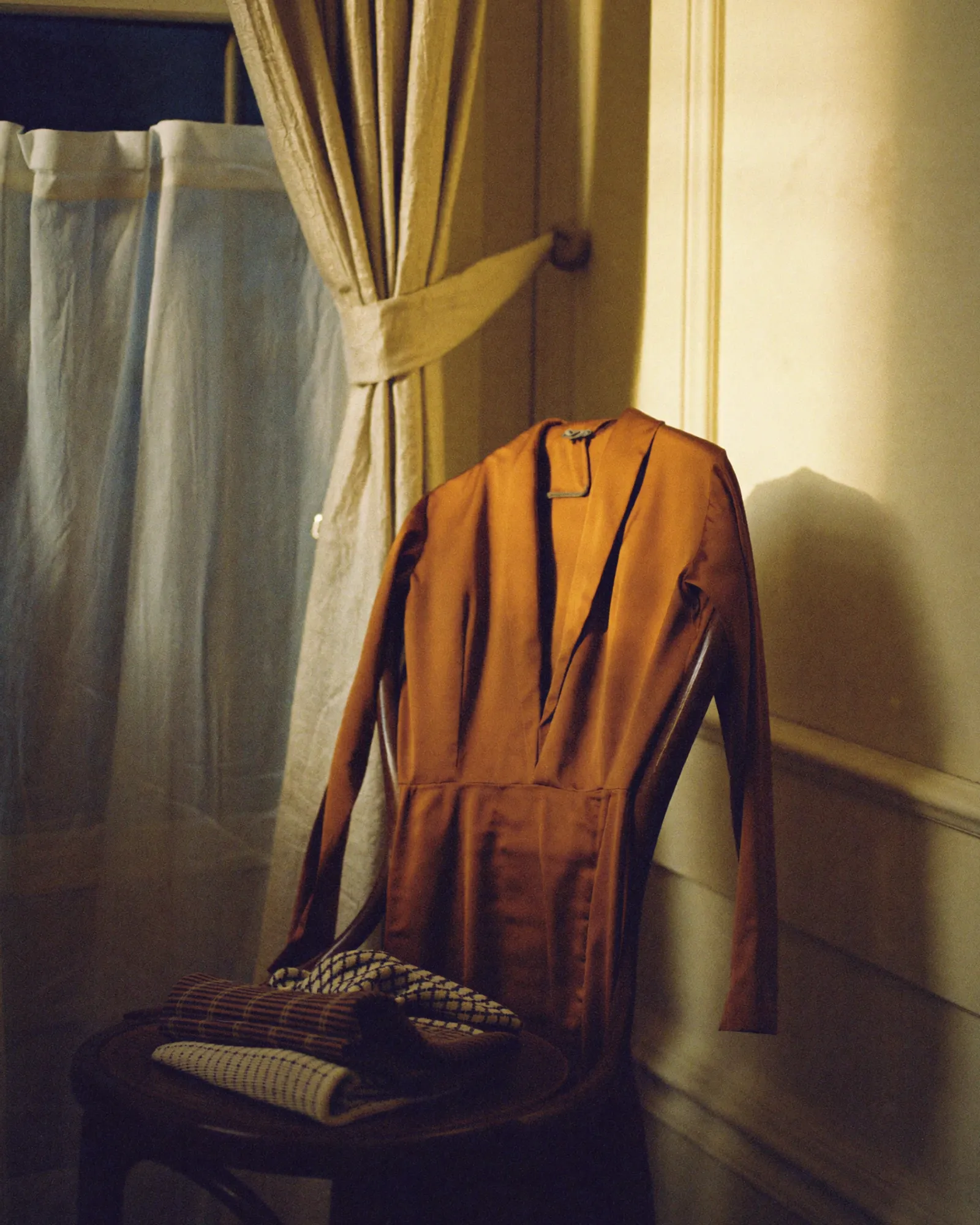 A stack of folded linen clothes in warm tones