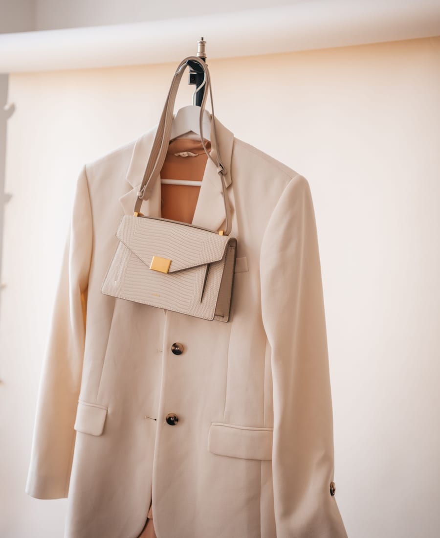 A designer handbag and blazer