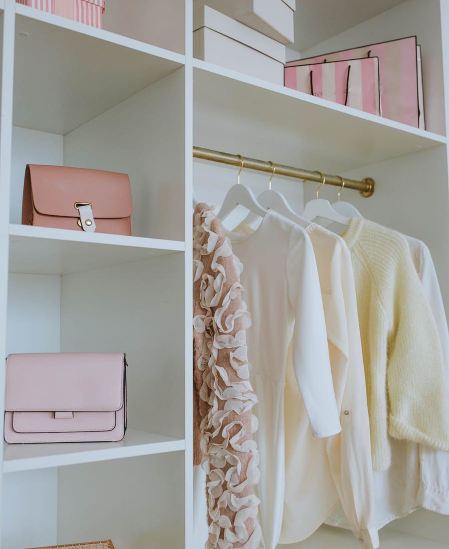 An organised wardrobe of pre-loved pieces